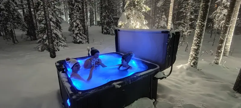 Outdoor hot tub on a snowy terrace in Levi
